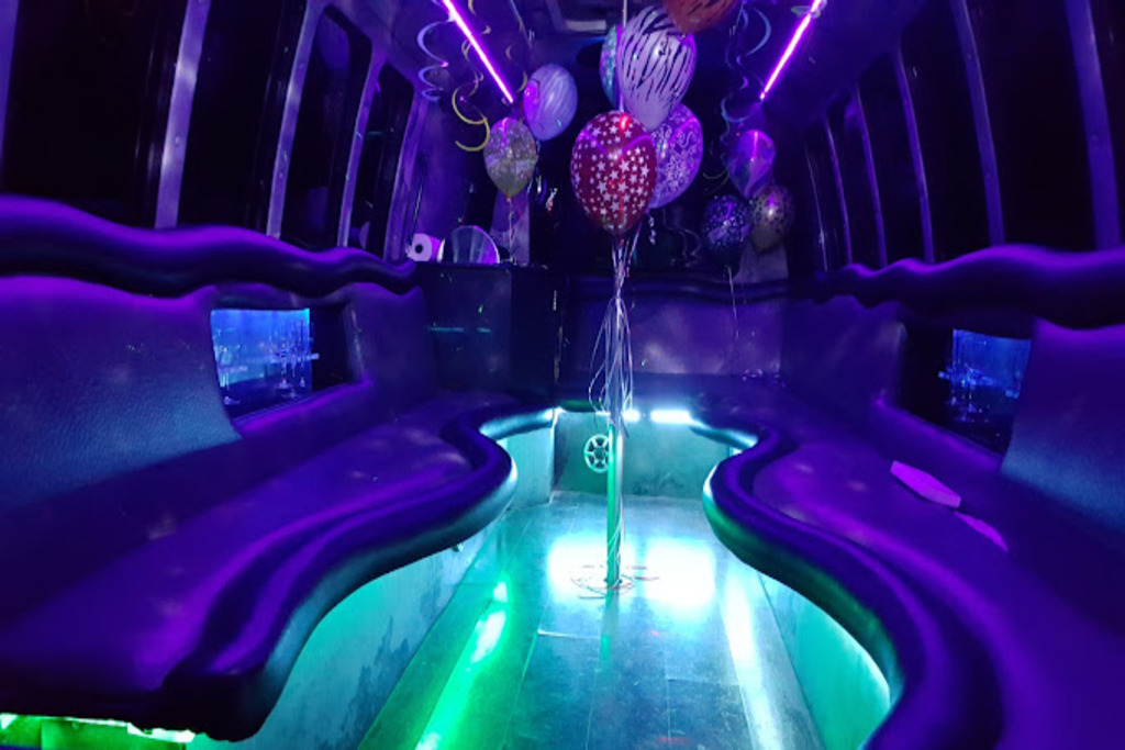 A party bus with purple lights and balloons